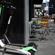 A LimeBike dockless scooter, shown alongside one from competitor Bird.